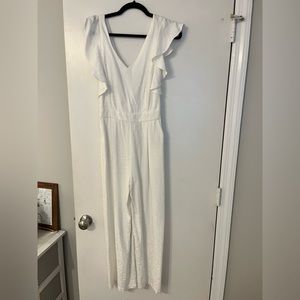 Beautiful white jumpsuit with pockets. NWT